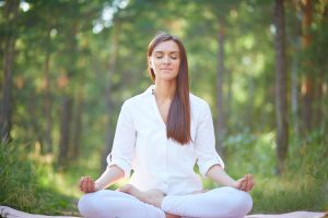 concentrated-woman-meditating-nature_1098-1412